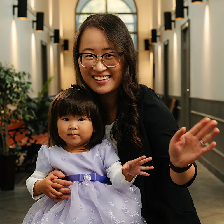 Image of a woman holding her daughter