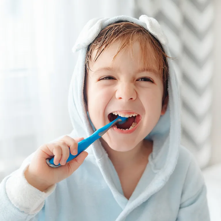 Image of a child brushing their teeth