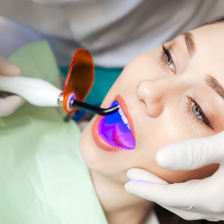 Image of a dentist working in a patients mouth