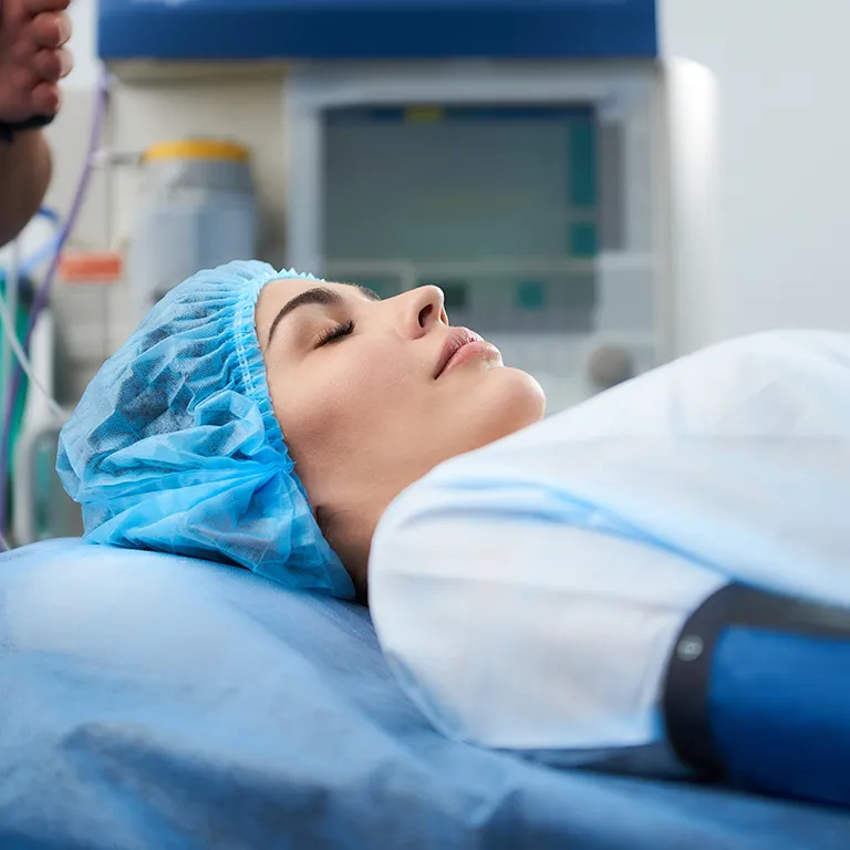 Image of a woman asleep on a dentist chair