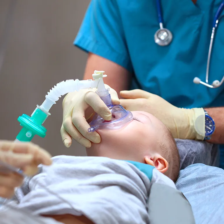 Image of a child going under sleep sedation