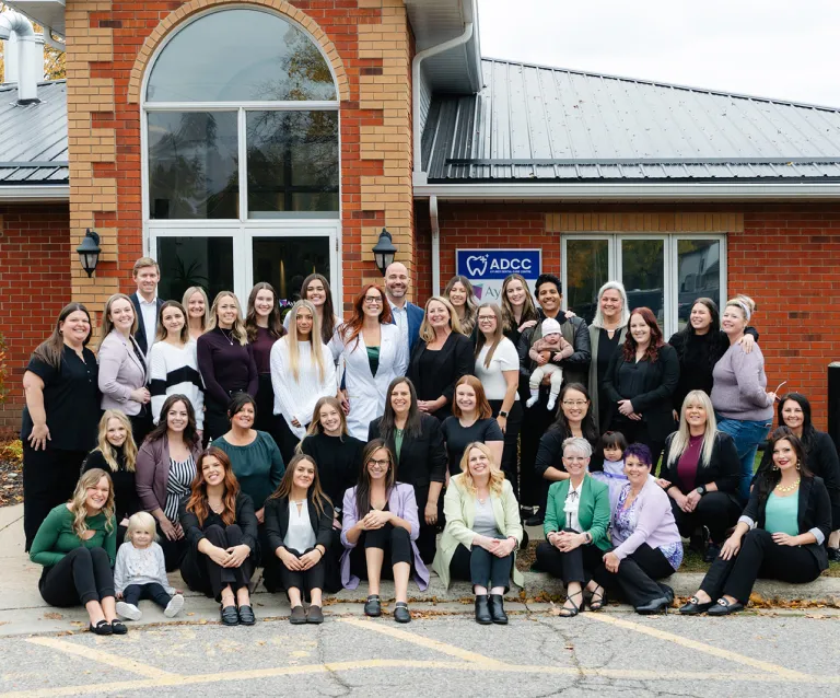 staff in front of building